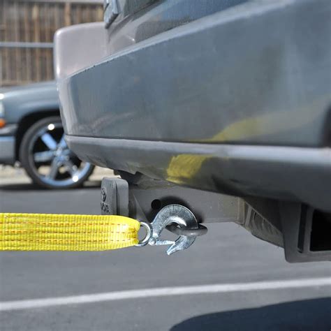 is towing with a tow strap illegal